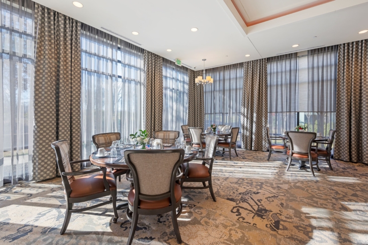 Bright and cozy dining area, inviting warmth and community with elegant decor and natural light.