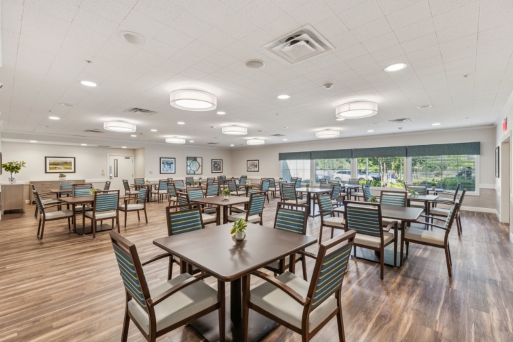 A bright, inviting dining area with comfortable seating, fostering community and connection.