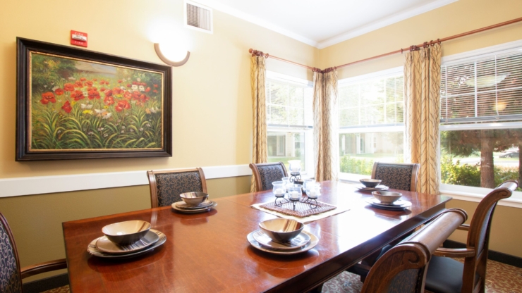 A warm dining space filled with natural light, inviting community gatherings and shared meals.