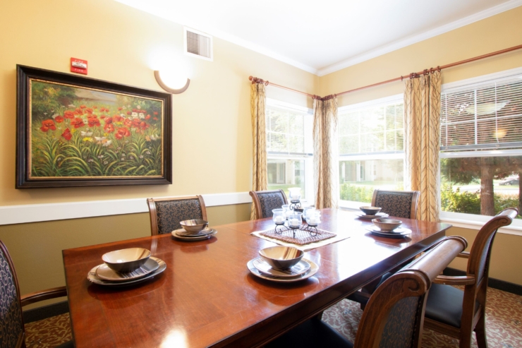 A warm dining space filled with natural light, inviting community gatherings and shared meals.