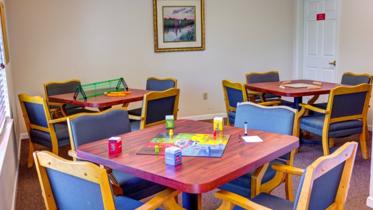 Bright, inviting space with games and comfortable seating, perfect for community gatherings.