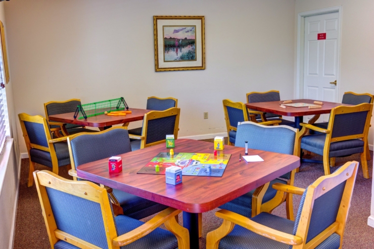 Bright, inviting space with games and comfortable seating, perfect for community gatherings.