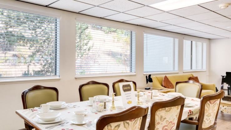 A cozy dining area with warm lighting, inviting decor, and a beautifully set table for shared meals.