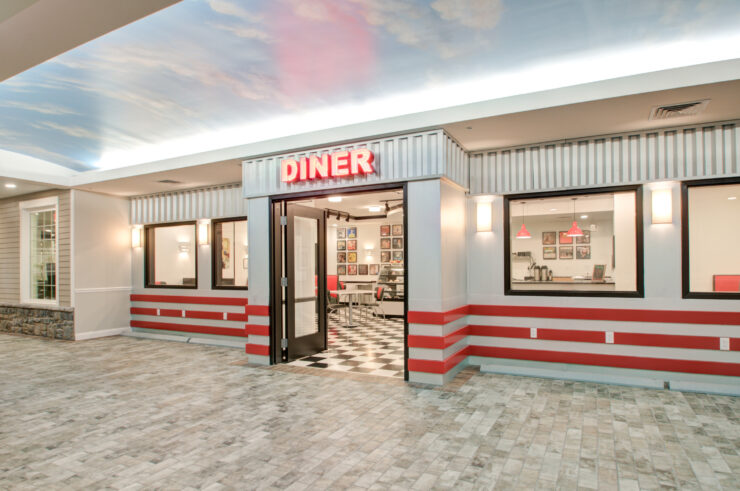 Bright and inviting diner entrance with a nostalgic design, fostering a welcoming community space.
