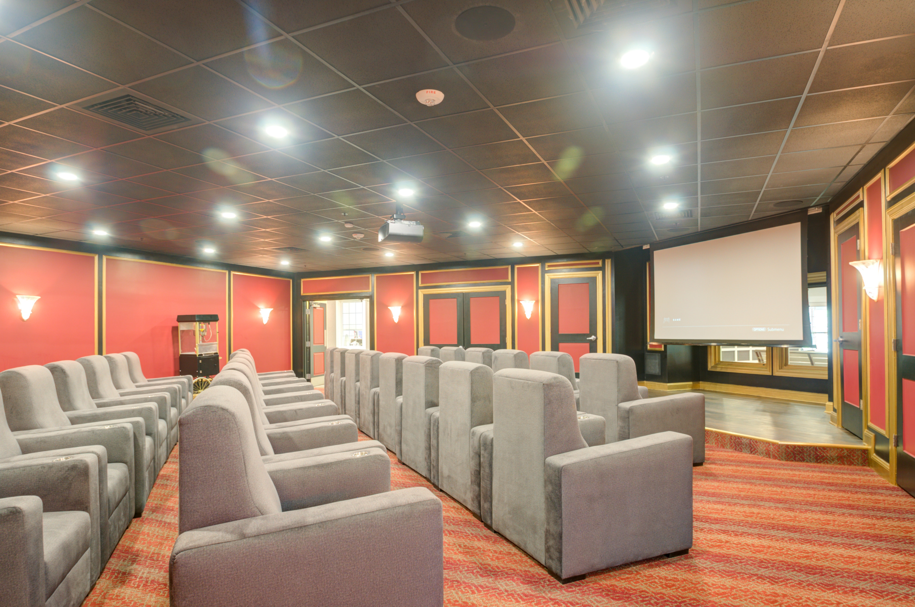 A welcoming theater space with plush seating, perfect for community gatherings and movie nights.