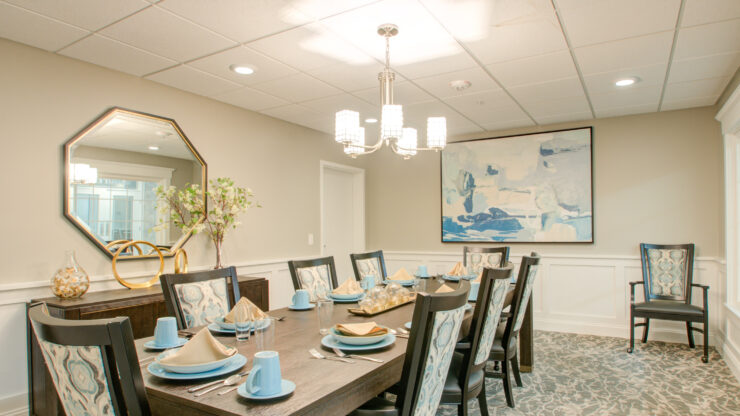 Bright dining room with elegant table setting, inviting for shared meals and community gatherings.