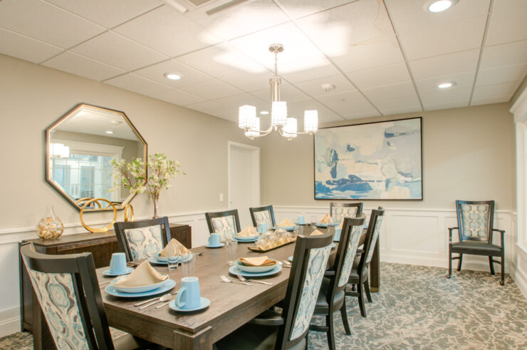 Bright dining room with elegant table setting, inviting for shared meals and community gatherings.