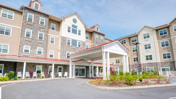 Welcoming retirement community with landscaped gardens and comfortable outdoor seating areas.