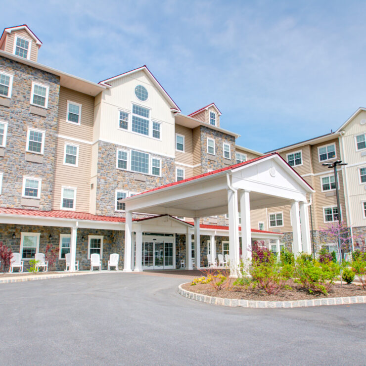 Welcoming retirement community with landscaped gardens and comfortable outdoor seating areas.