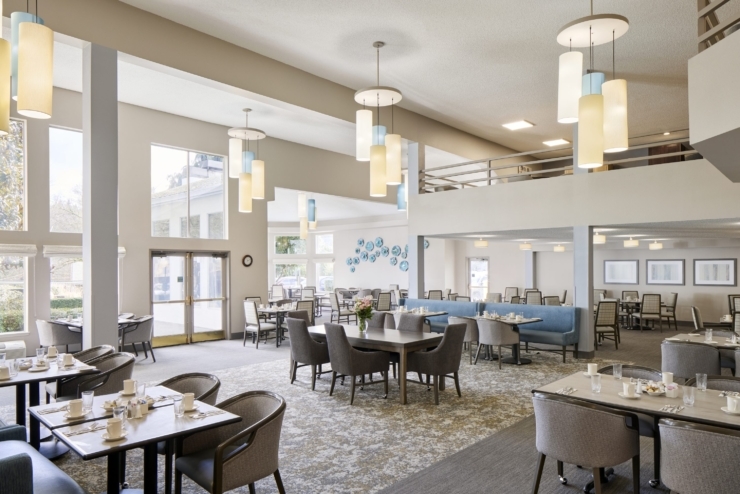 Bright and welcoming dining space fosters community and comfort, perfect for shared moments.
