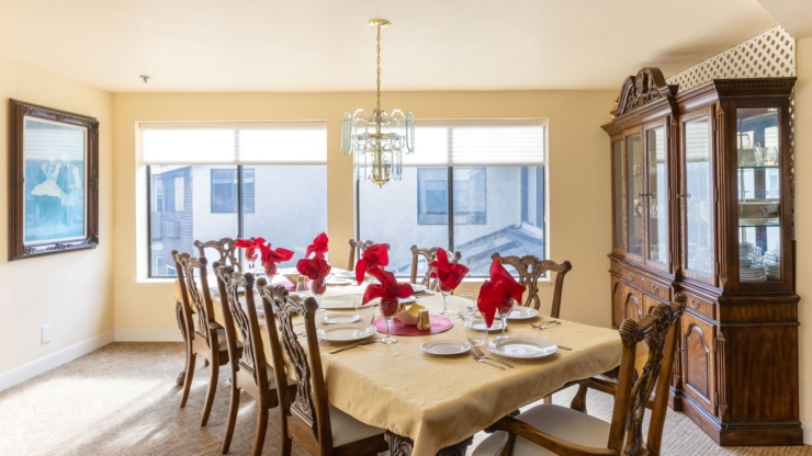 A welcoming dining area, beautifully set for community gatherings, radiates warmth and connection.