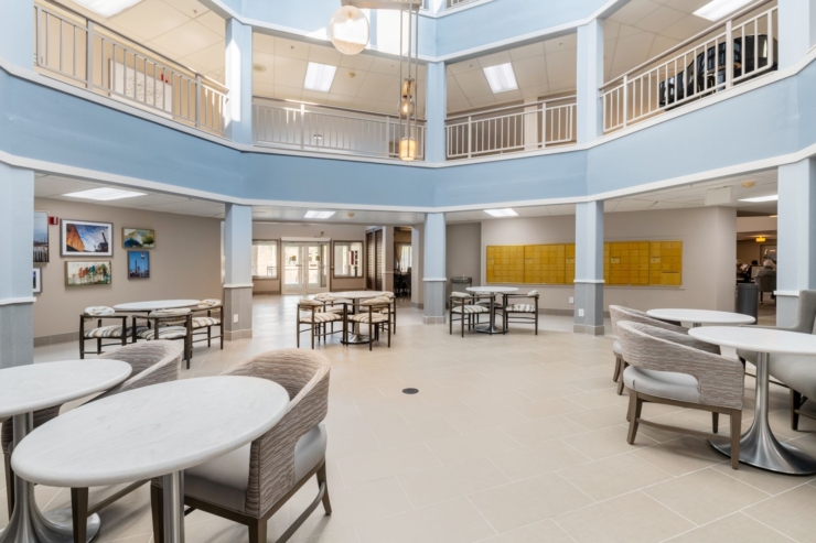 Bright, inviting space with comfortable seating, fostering community and connection among residents.