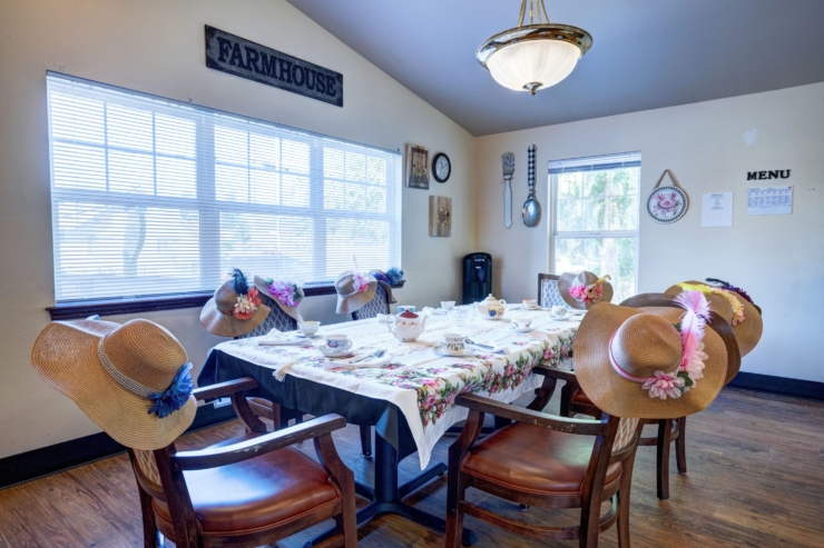 A cozy dining area adorned with floral decor, inviting community gatherings and joyful moments.