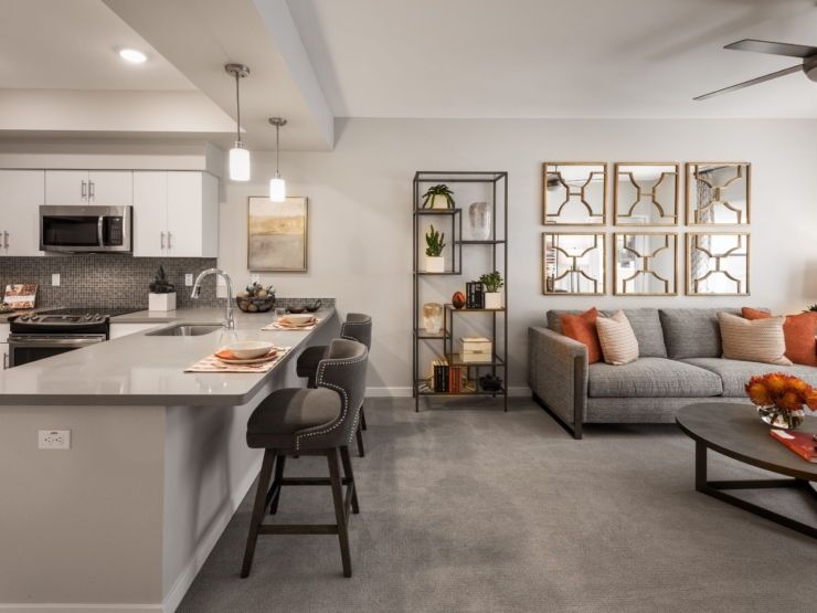 A bright, inviting living space featuring modern decor and cozy seating, perfect for community gatherings.