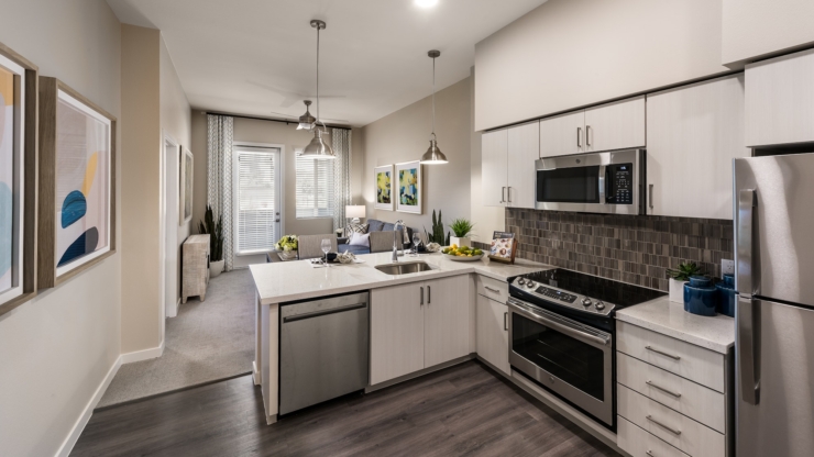 Bright, inviting kitchen blends modern design with comfort, perfect for a warm community atmosphere.