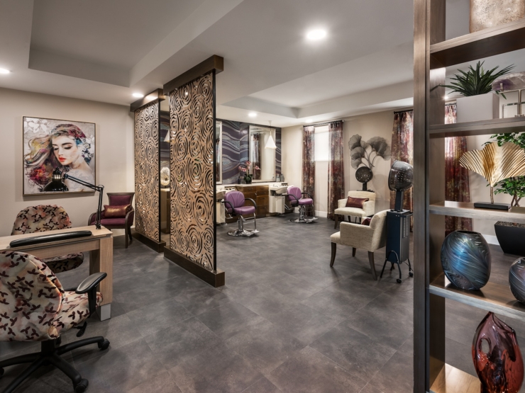 Bright and inviting, this stylish salon space fosters community and relaxation for residents.