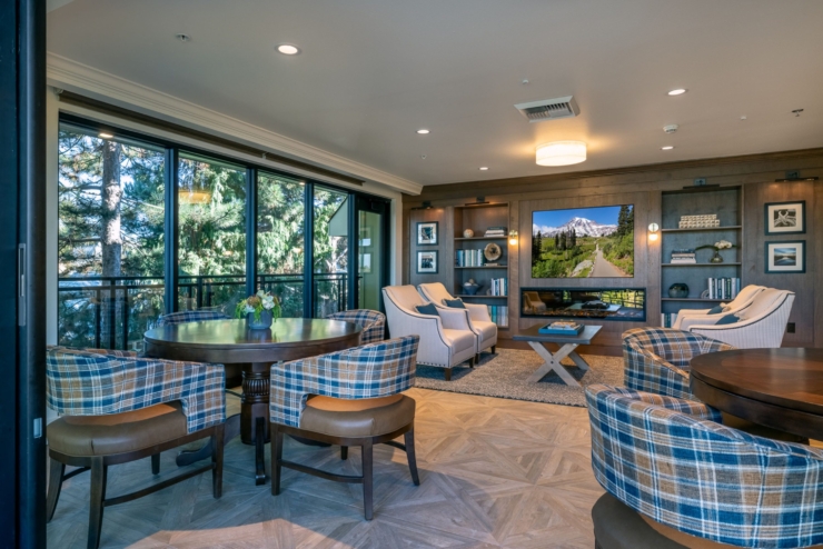 A welcoming gathering space, featuring comfortable seating and large windows with serene views.