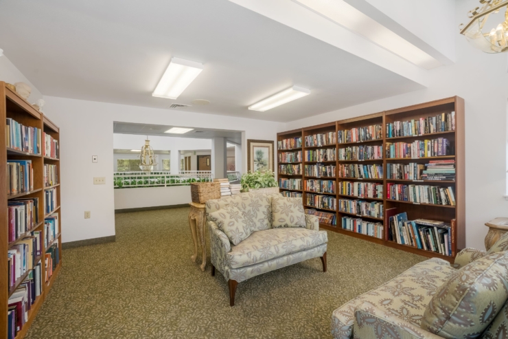 A welcoming reading nook, filled with books and comfortable seating, perfect for relaxation and connection.