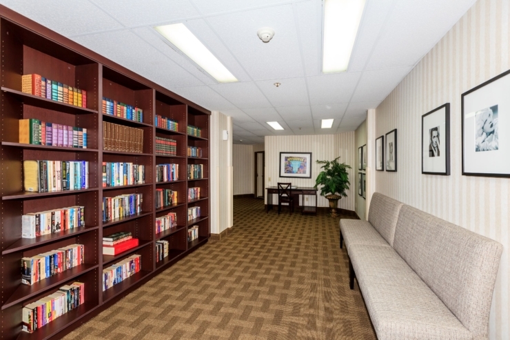 A welcoming space filled with books, comfortable seating, and warm decor, perfect for community gatherings.