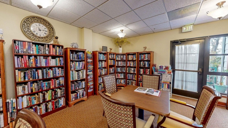 A welcoming library filled with books, inviting seating, and natural light, perfect for community gatherings.