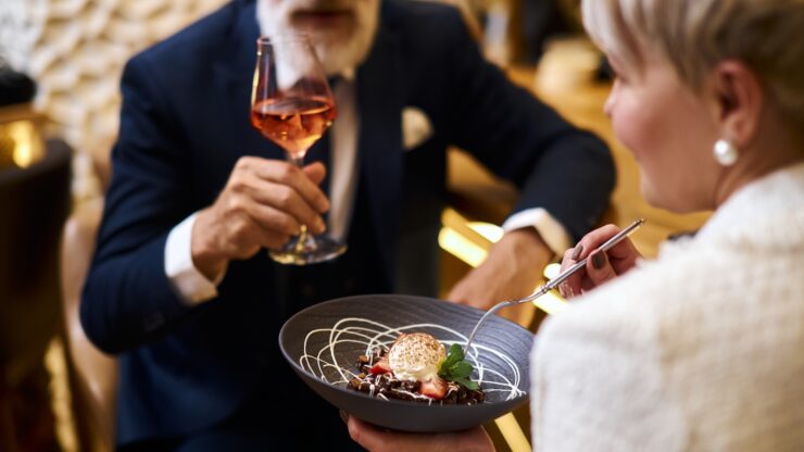 Enjoying a delightful meal together, this scene radiates warmth and community spirit.