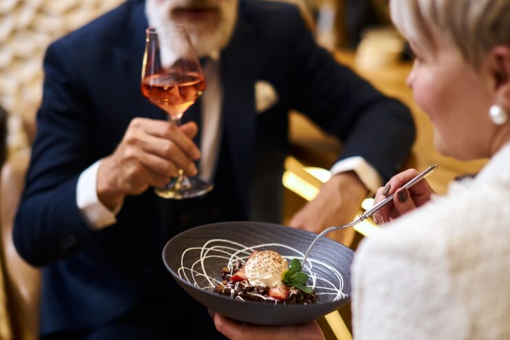 Enjoying a delightful meal together, this scene radiates warmth and community spirit.