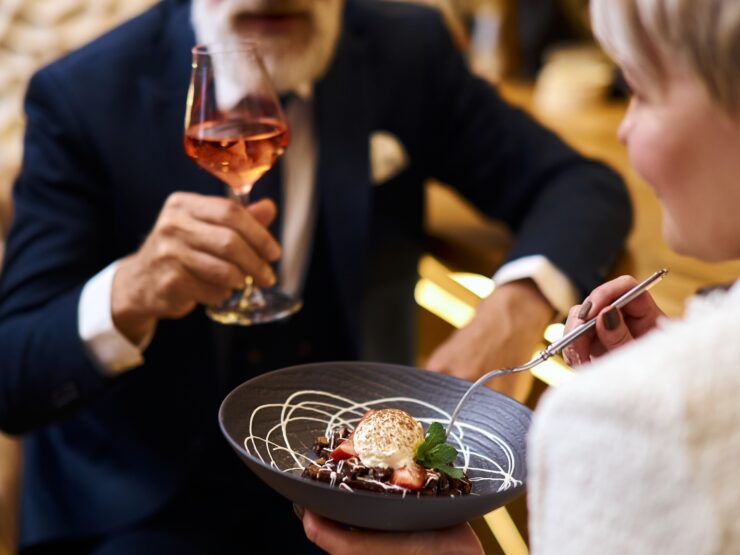 Enjoying a delightful meal together, this scene radiates warmth and community spirit.