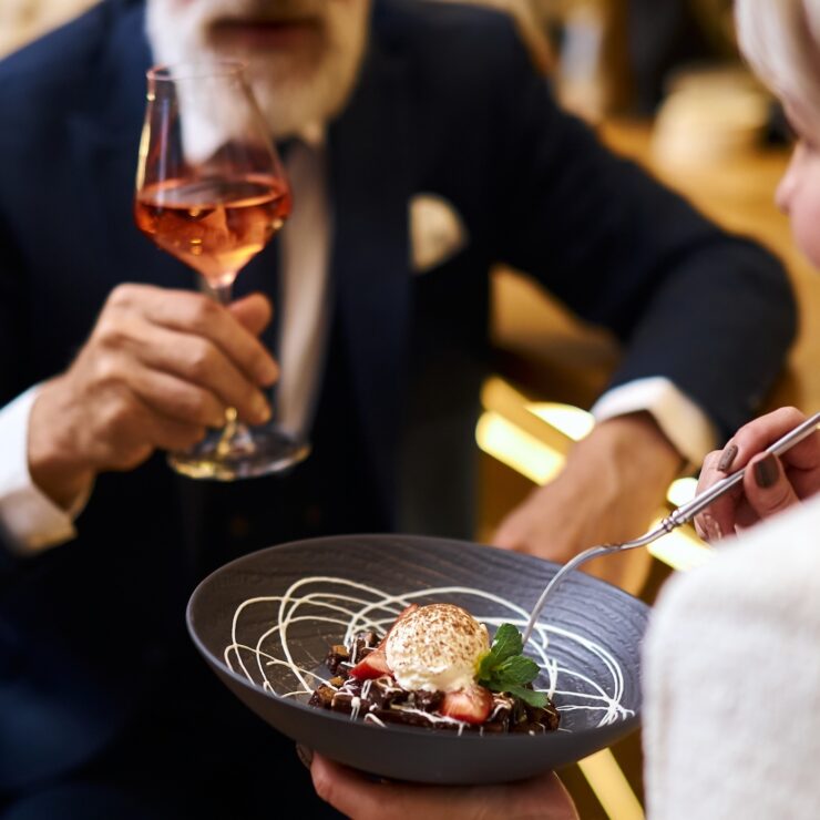 Enjoying a delightful meal together, this scene radiates warmth and community spirit.