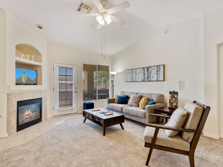 A cozy living space with warm tones, inviting furniture, and natural light, perfect for community gatherings.