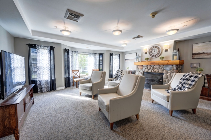 Bright and inviting lounge with cozy seating, warm decor, and natural light, fostering community and comfort.
