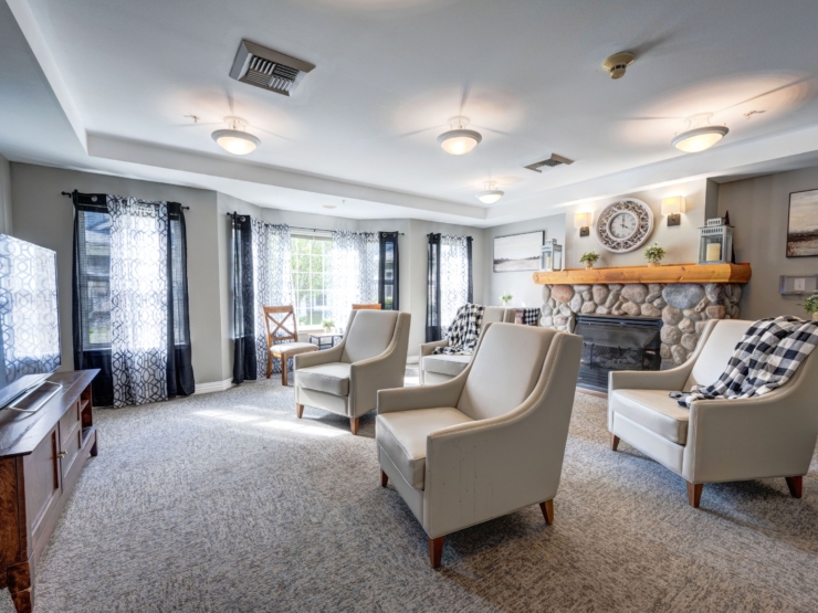 Bright and inviting lounge with cozy seating, warm decor, and natural light, fostering community and comfort.