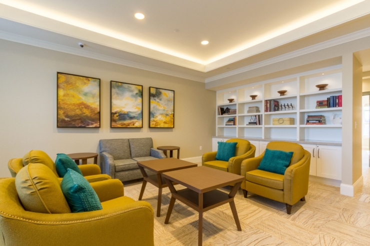 A cozy lounge with vibrant seating and warm decor, inviting community and connection.