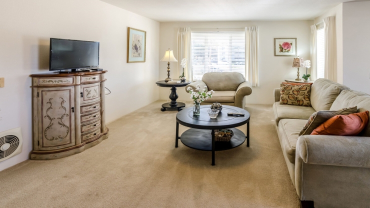 Bright and inviting common area, featuring cozy seating and warm decor, perfect for community gatherings.