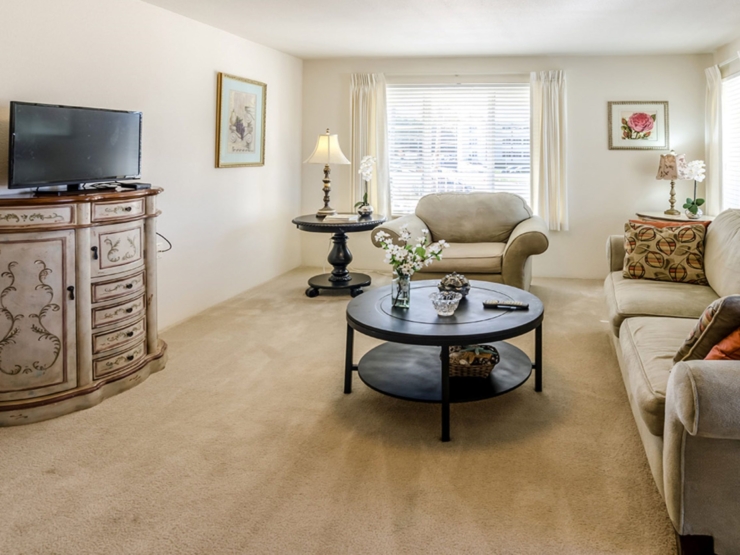 Bright and inviting common area, featuring cozy seating and warm decor, perfect for community gatherings.