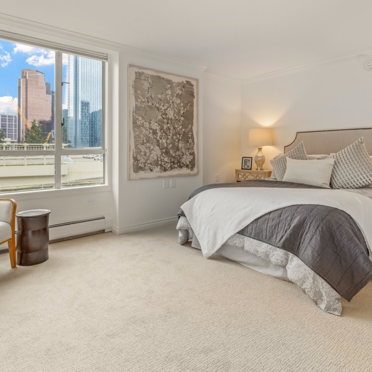 Bright and inviting bedroom with a serene view, perfect for relaxation and community living.