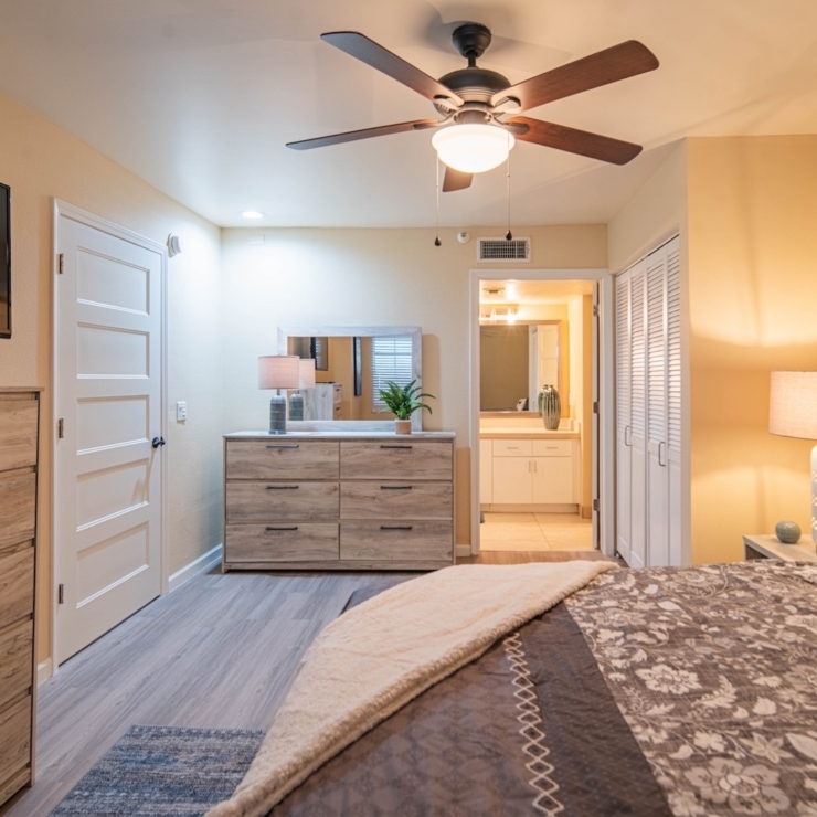 Bright, inviting bedroom with warm colors and modern furnishings, creating a welcoming atmosphere.