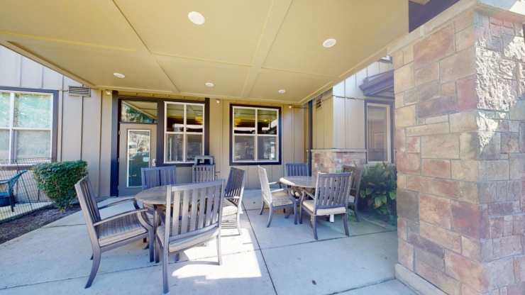 A welcoming outdoor space with comfortable seating invites relaxation and connection among residents.