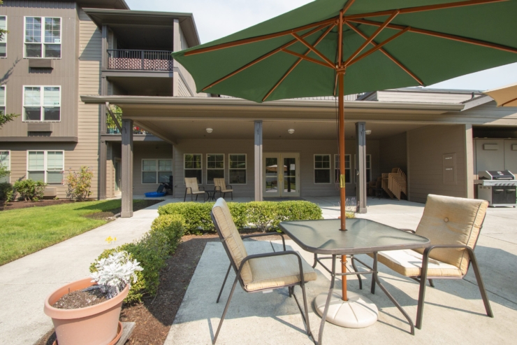 A welcoming outdoor space featuring comfortable seating, inviting greenery, and a serene atmosphere.