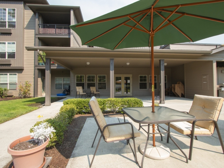 A welcoming outdoor space featuring comfortable seating, inviting greenery, and a serene atmosphere.
