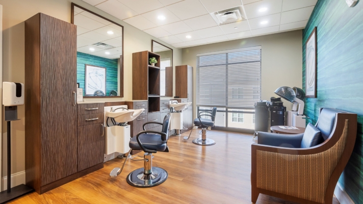 A bright, welcoming salon space designed for relaxation and community, perfect for pampering residents.
