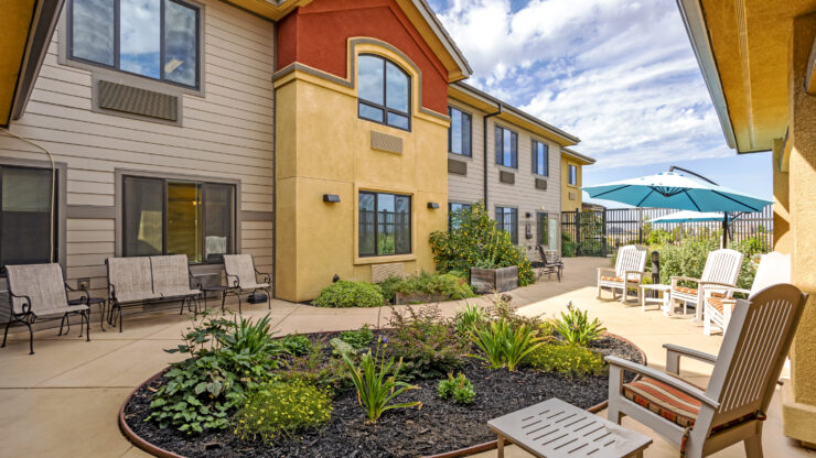 Bright and inviting outdoor seating area, perfect for relaxation and community gatherings.
