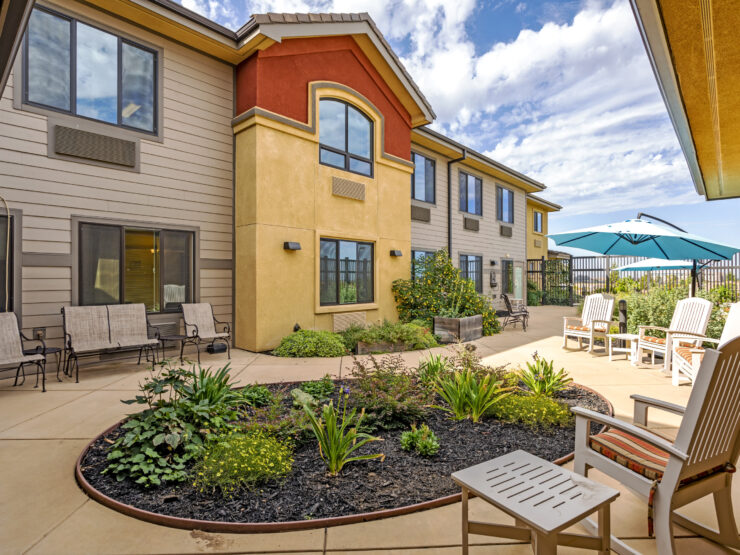 Bright and inviting outdoor seating area, perfect for relaxation and community gatherings.