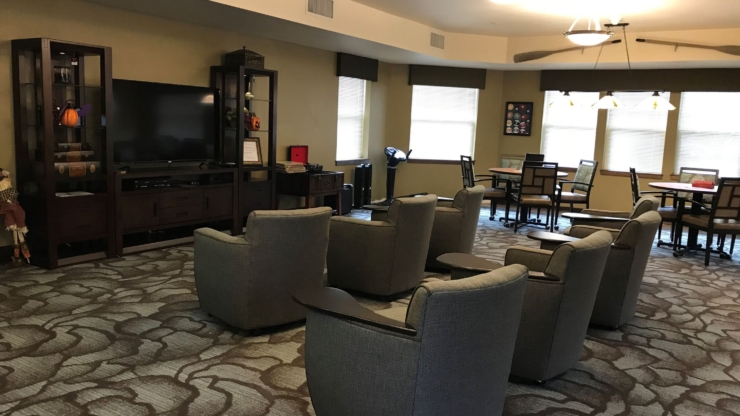 A cozy community space, inviting relaxation and connection with comfortable seating and warm decor.