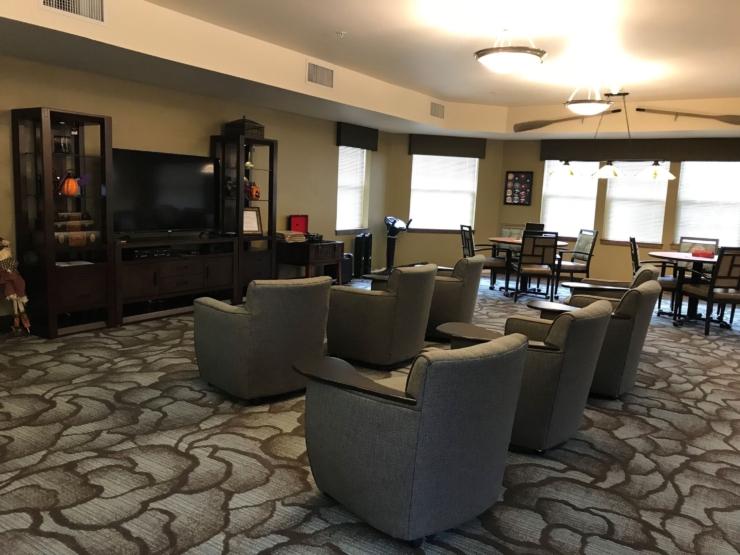 A cozy community space, inviting relaxation and connection with comfortable seating and warm decor.