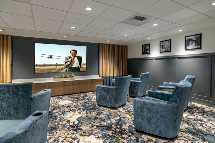 A welcoming lounge features plush seating, ideal for movie nights that foster connection and joy.