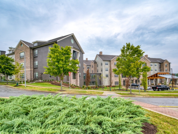 A welcoming community with beautiful buildings and lush greenery, perfect for comfortable living.