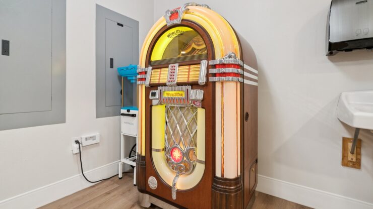 A vintage jukebox adds a touch of nostalgia, inviting joyful gatherings and shared memories.