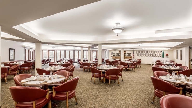 Bright, inviting dining space with warm furnishings, perfect for community meals and connection.
