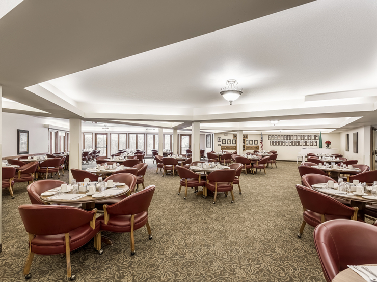 Bright and inviting dining area, featuring comfortable seating and warm decor, perfect for community gatherings.