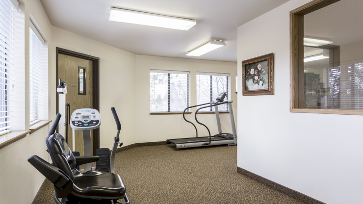 A bright, inviting exercise area featuring warm decor, fostering community and wellness.